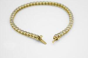 BRACCIALE TENNIS ORO GIALLO E ZIRCONI