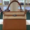 Herm&egrave;s Kelly 25 retourne Nuova 2026 stampa K in pelle togo colore gold hardware in palladio