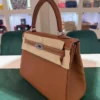 Herm&egrave;s Kelly 25 retourne Nuova 2026 stampa K in pelle togo colore gold hardware in palladio