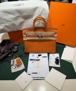Alternative view of Hermès Birkin 25 retourne veau togo colore orange  stampa G NUOVA 2026 Marzo hardware palladio