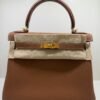 Herm&egrave;s Kelly 28 retourne NUOVA 2026 seriale G color gold (marrone) pellame Togo con hardware dorato